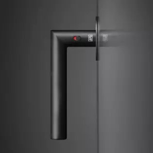 The picture shows the door handle Lucia in graphite black mounted on a black wooden door.